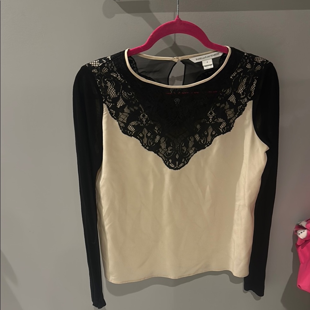Cream long sleeve blouse with lace detailing and a crew neck
